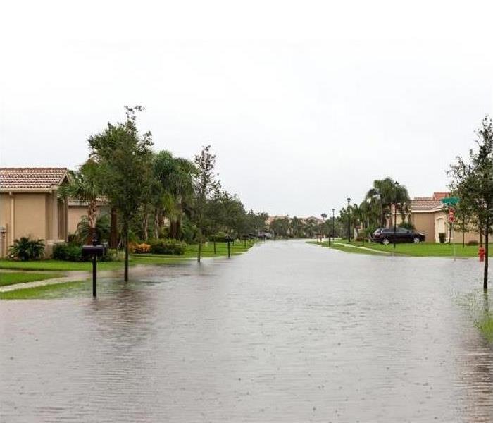 Flooded streets in a neighborhood.